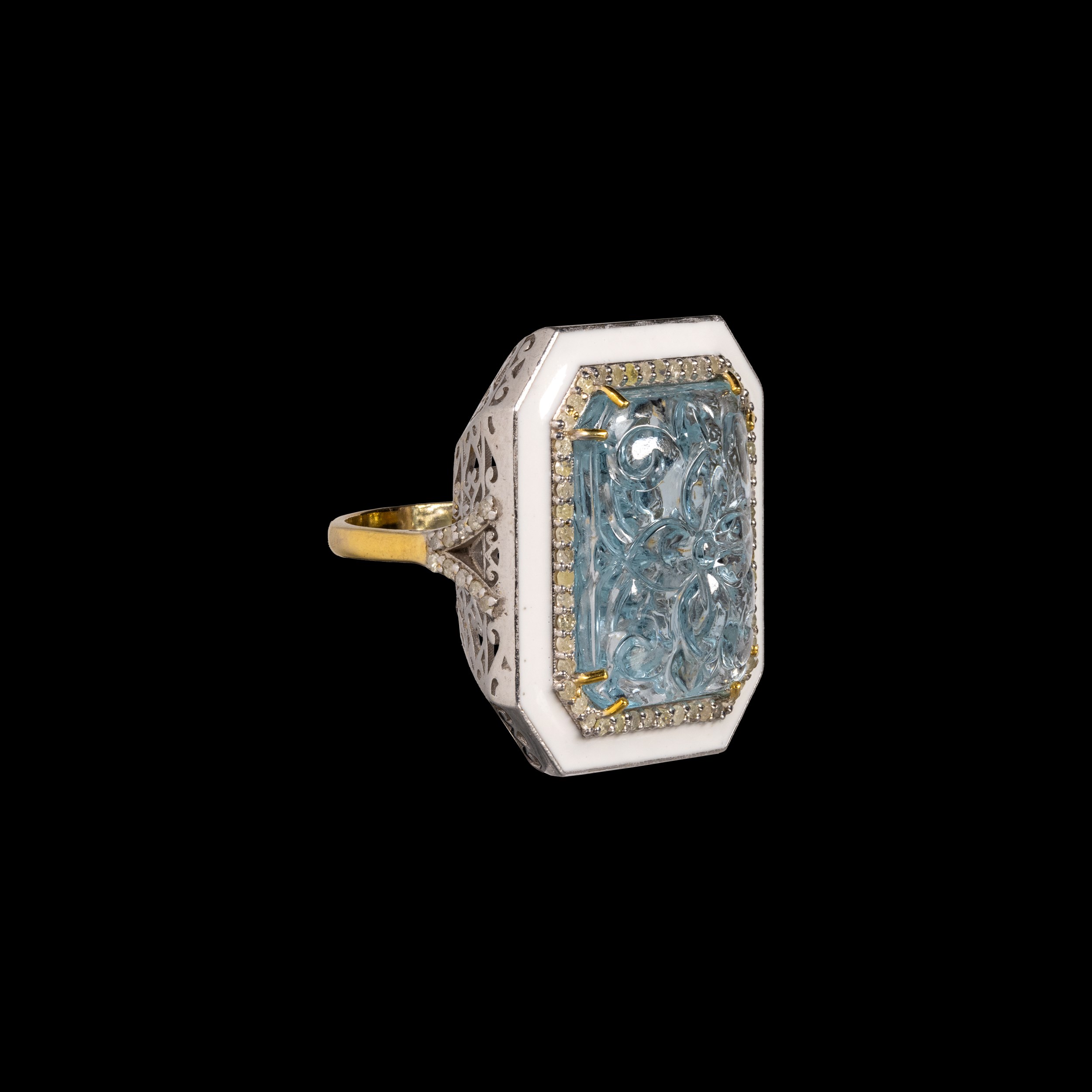 A silver and gold ring with enamel and aquamarine.